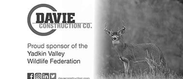 A black and white photo of a deer with the sponsor of the valley federation logo.