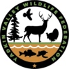 A black and green logo with animals, trees, fish, and deer.